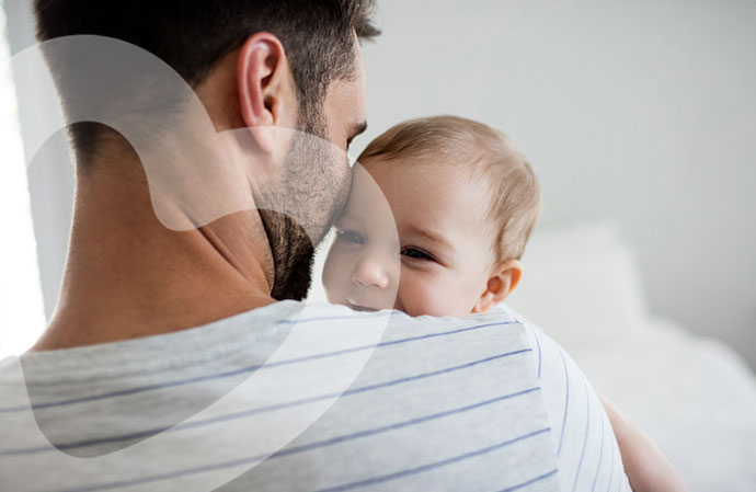 Father holding happy smiling baby 